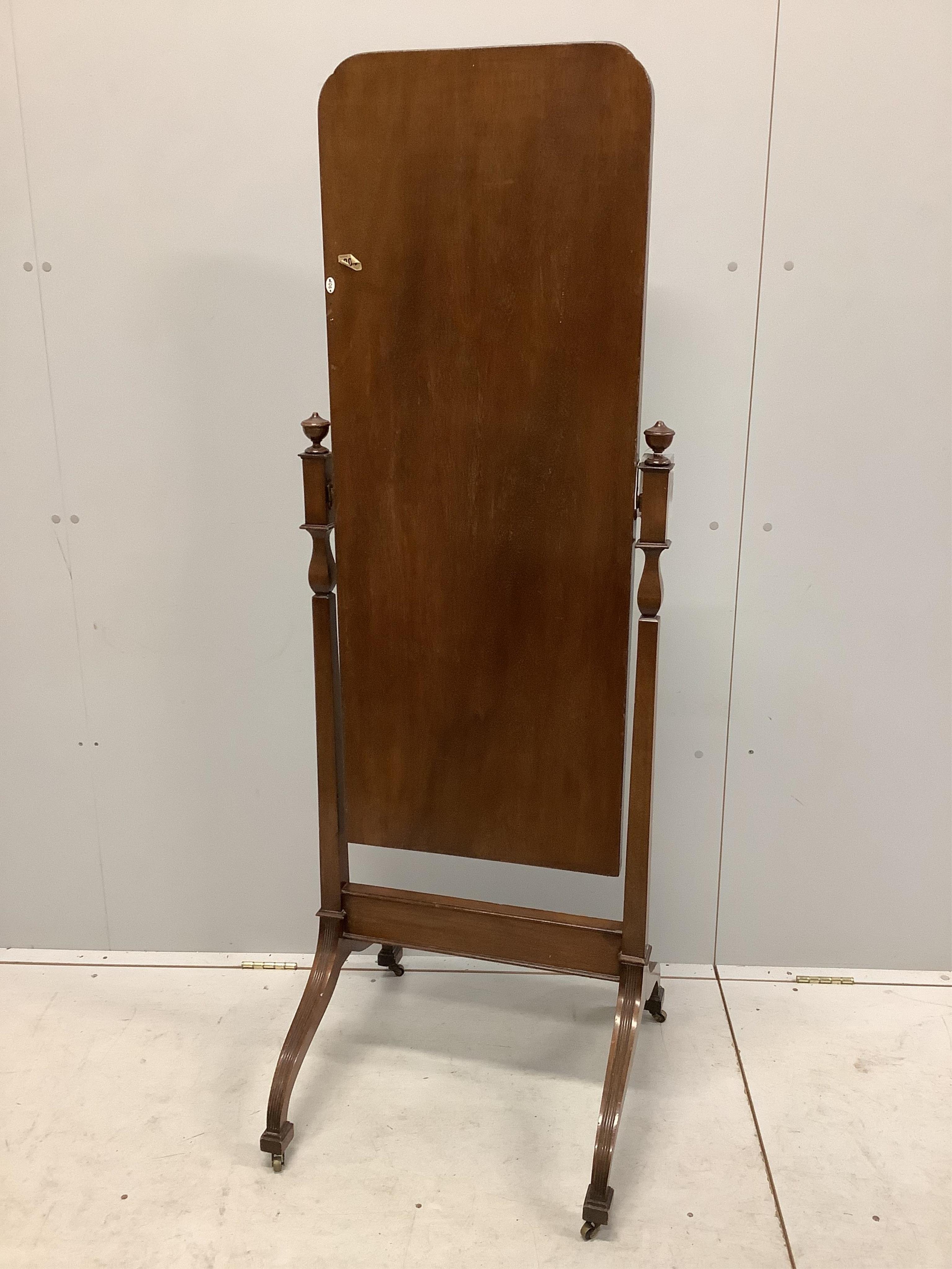 An early 20th century mahogany cheval mirror with moulded frame and reeded down swept legs, width 54cm, height 159cm. Condition - fair